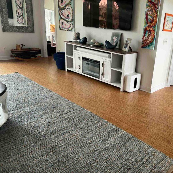 Casablanca floating cork flooring in a living room with a large grey rug and nautical decor.